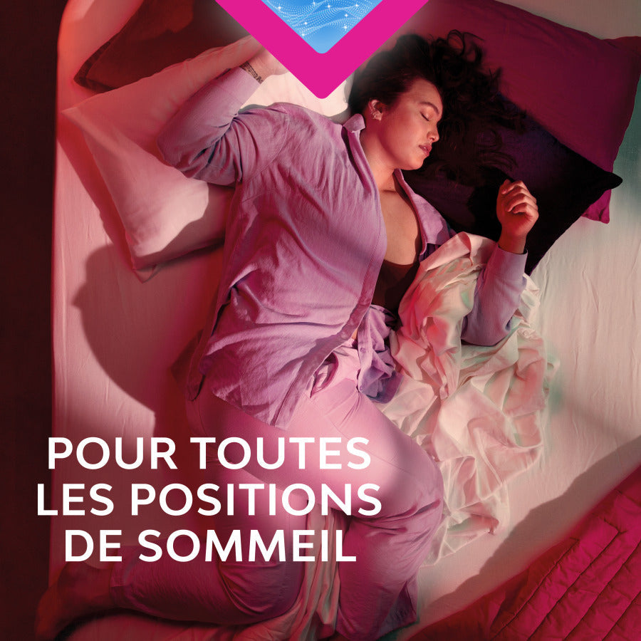 Femme endormie illustrant l'utilisation des serviettes Nana Ultra Goodnight Large avec ailettes, offrant protection maximale et ajustement optimal pendant le sommeil.